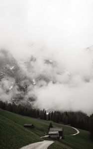 Preview wallpaper road, mountains, hills, trees, houses, clouds, nature