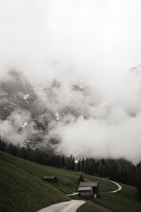 Preview wallpaper road, mountains, hills, trees, houses, clouds, nature