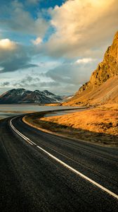 Preview wallpaper road, mountains, rocks, water, turn