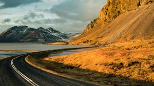 Preview wallpaper road, mountains, rocks, water, turn