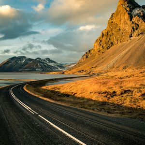 Preview wallpaper road, mountains, rocks, water, turn