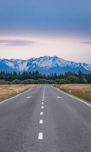 Preview wallpaper road, mountains, rocks, snow, distance