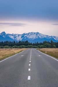 Preview wallpaper road, mountains, rocks, snow, distance