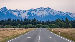 Preview wallpaper road, mountains, rocks, snow, distance