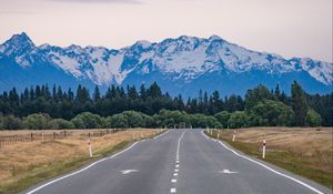 Preview wallpaper road, mountains, rocks, snow, distance