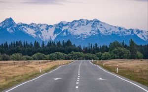 Preview wallpaper road, mountains, rocks, snow, distance