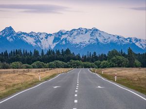 Preview wallpaper road, mountains, rocks, snow, distance