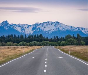 Preview wallpaper road, mountains, rocks, snow, distance