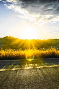 Preview wallpaper road, mountains, sun, glare, sunny