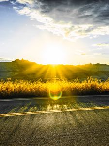 Preview wallpaper road, mountains, sun, glare, sunny