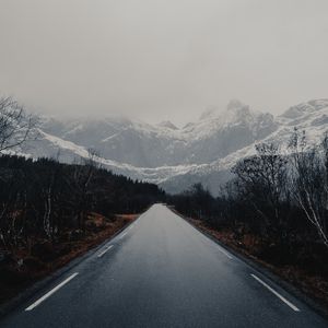 Preview wallpaper road, mountains, trees, asphalt, wet