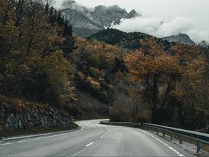 Preview wallpaper road, mountains, turn, trees, clouds