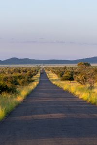 Preview wallpaper road, nature, trees, hills, sky