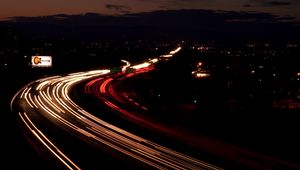 Preview wallpaper road, night, traffic, turn, sign