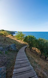 Preview wallpaper road, path, slope, sea, horizon