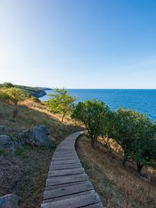 Preview wallpaper road, path, slope, sea, horizon