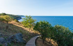 Preview wallpaper road, path, slope, sea, horizon