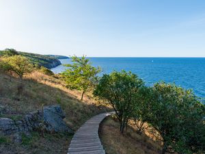 Preview wallpaper road, path, slope, sea, horizon