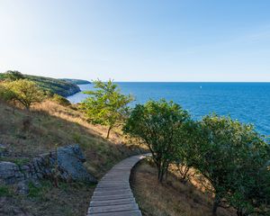 Preview wallpaper road, path, slope, sea, horizon