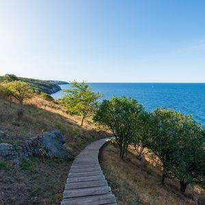 Preview wallpaper road, path, slope, sea, horizon