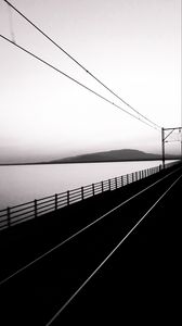 Preview wallpaper road, rails, bw, hill, water