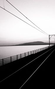 Preview wallpaper road, rails, bw, hill, water