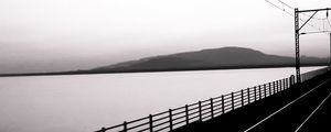 Preview wallpaper road, rails, bw, hill, water