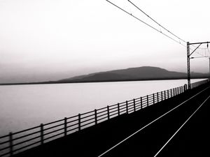 Preview wallpaper road, rails, bw, hill, water