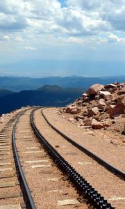 Preview wallpaper road, rails, cross ties, desert, stones, sand, day