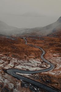 Preview wallpaper road, relief, fog, winding, snowy