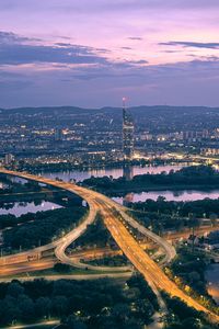 Preview wallpaper road, river, buildings, lights, city, twilight