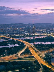 Preview wallpaper road, river, buildings, lights, city, twilight