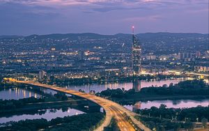 Preview wallpaper road, river, buildings, lights, city, twilight