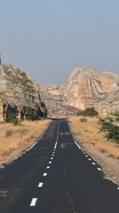 Preview wallpaper road, rocks, grass, dry, nature