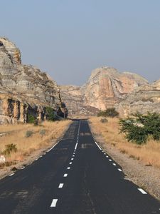 Preview wallpaper road, rocks, grass, dry, nature