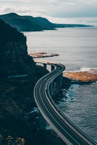 Preview wallpaper road, rocks, sea, winding