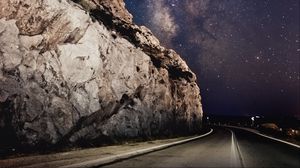 Preview wallpaper road, rocks, starry sky, stars, night