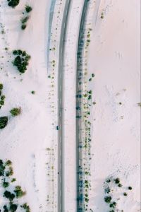 Preview wallpaper road, sand, aerial view, car, bushes