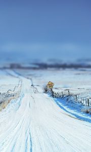 Preview wallpaper road, sign, snow, winter, protections, stakes, field