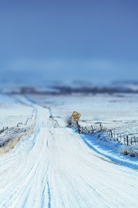 Preview wallpaper road, sign, snow, winter, protections, stakes, field