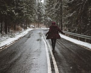 Preview wallpaper road, silhouette, trees, turn, snow, asphalt, wet