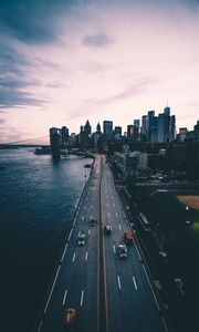 Preview wallpaper road, skyscrapers, metropolis, sea, traffic