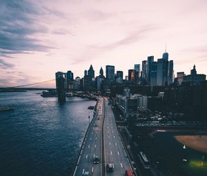 Preview wallpaper road, skyscrapers, metropolis, sea, traffic