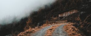 Preview wallpaper road, slope, trees, building, cloud