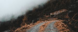 Preview wallpaper road, slope, trees, building, cloud