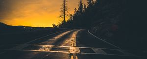 Preview wallpaper road, slope, turn, sunset, twilight, glow, asphalt, road marking