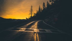 Preview wallpaper road, slope, turn, sunset, twilight, glow, asphalt, road marking