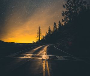 Preview wallpaper road, slope, turn, sunset, twilight, glow, asphalt, road marking