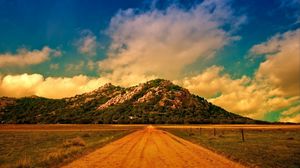 Preview wallpaper road, soil, straight line, mountain, clouds, sky