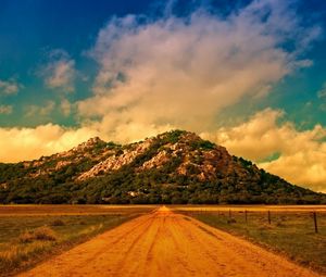 Preview wallpaper road, soil, straight line, mountain, clouds, sky